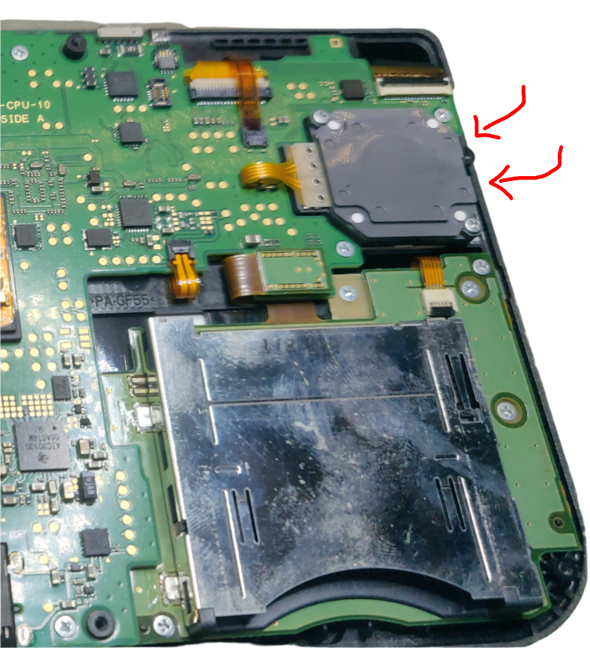 Close-up of a green electronic circuit board with various components.