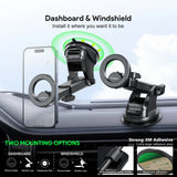 Black magnetic car dashboard and windshield phone mount shown installed on a car dashboard, with a smartphone placed in the mount. The image includes text explaining two mounting options: dashboard and windshield, plus a small inset showing the strong 3M adhesive.
